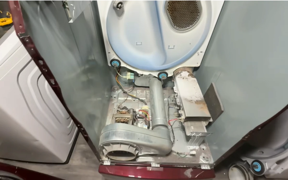 Dryer interior with dust and residue built up before cleaning