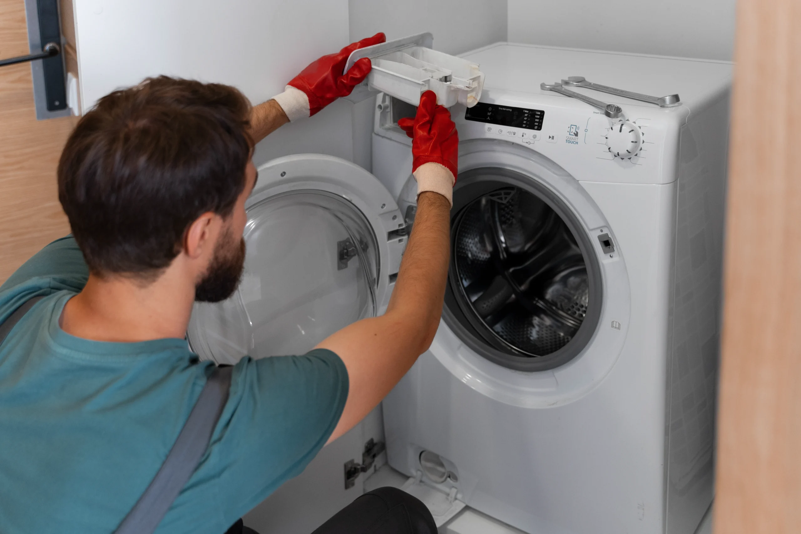 Technician inspecting the inside of a dryer during diagnosis